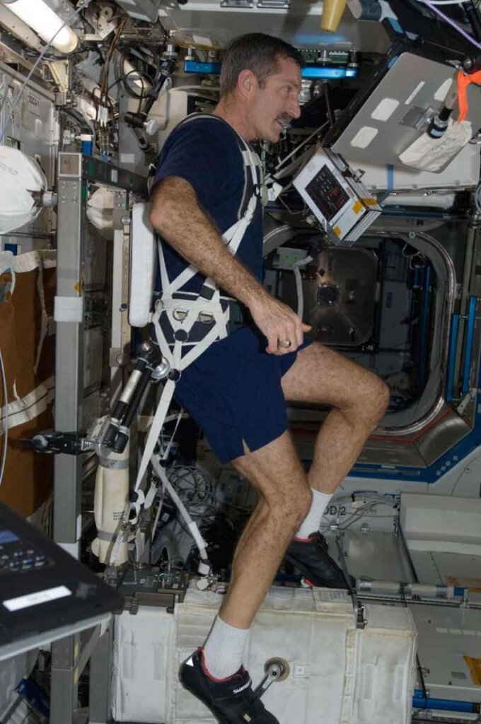 Astronaut excercises on the Cycle Ergometer with Vibration Isolation System on the ISS