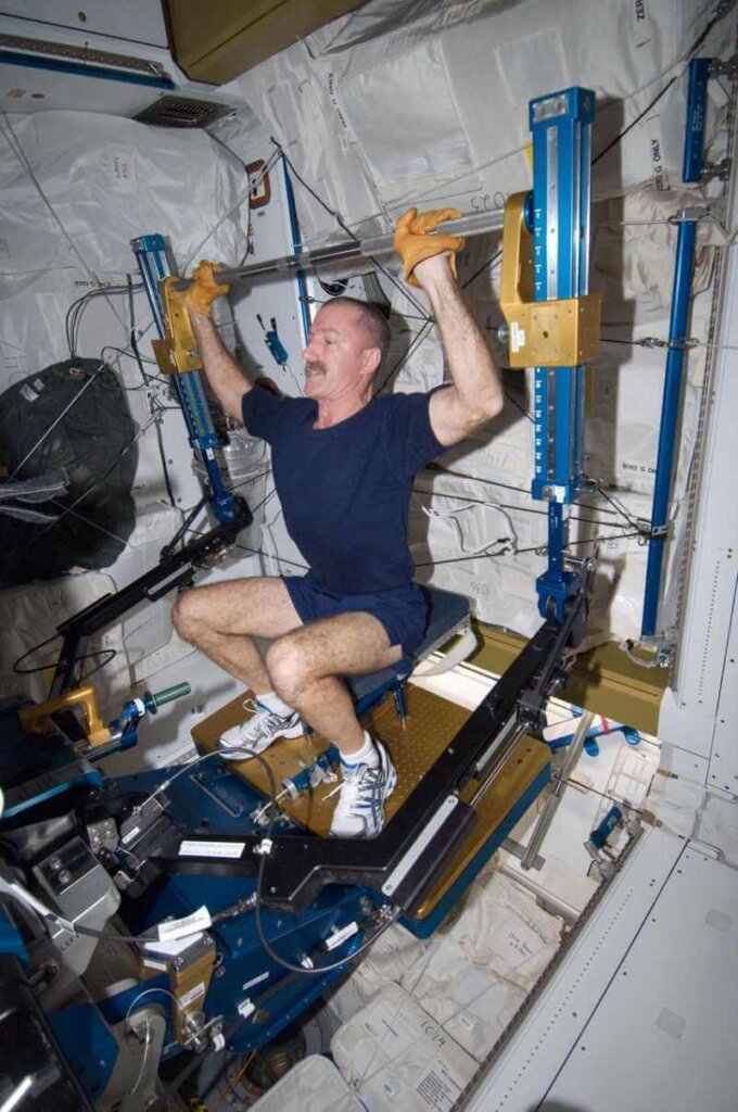 Astronaut using aRED on the International Space Station