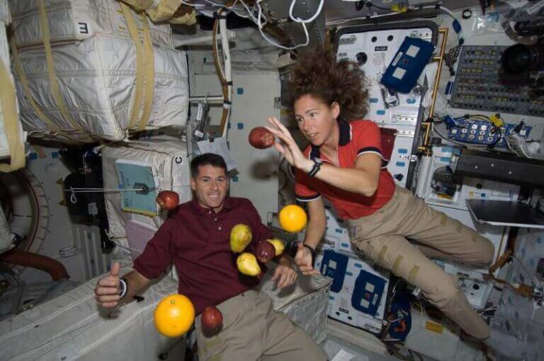 Astronauts Shane Kimbrough and Sandra Magnus are pictured with fresh fruit floating free