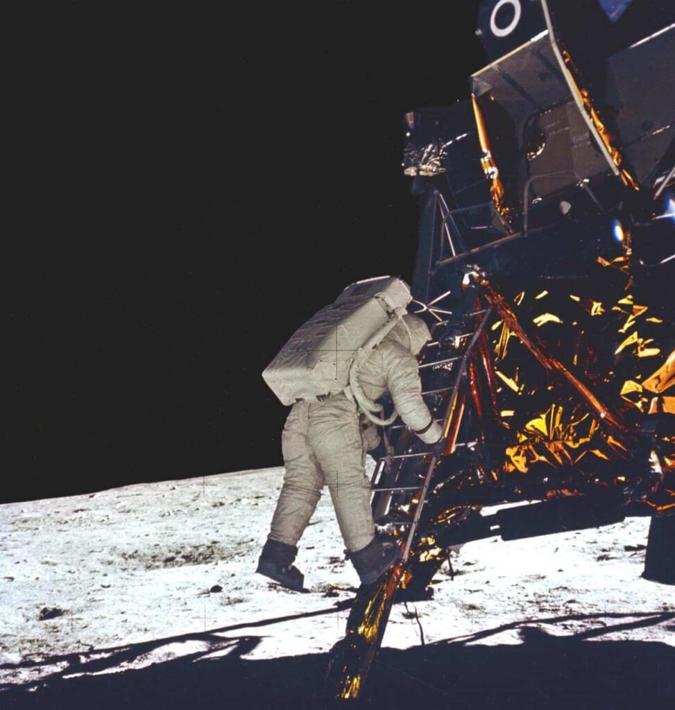Neil Armstrong taking first step on the moon