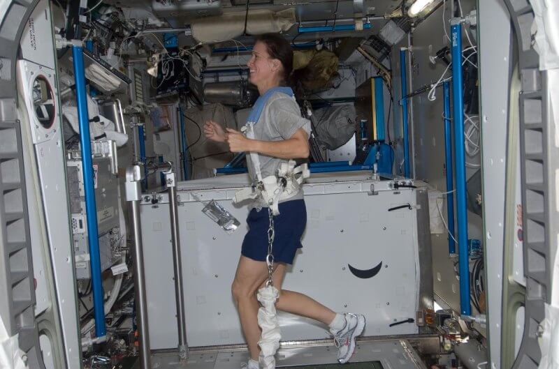 Astronaut using a treadmill on the international space station