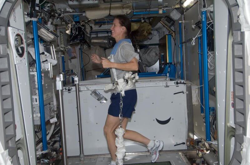 Astronaut using a treadmill on the international space station