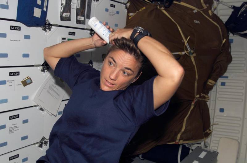 Astronaut Washing Hair